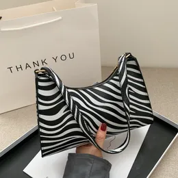 Bolsas de noite moda zebra impressão feminina bolsa de luxo pu simples ombro de fêmea de design diário de design diário bolsa 230329