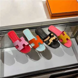 Diseñador Herms zapatillas Sandalias de tacón plano de cuero de cuero en la primavera de 2023 Fashion