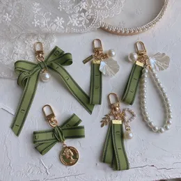Designer keychain Luxury key chain bag charm female car key ring Pearl charm green ribbon delicate shells keychain couple pendant gift nice good