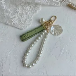 Дизайнерский брелок роскошный ключ для сети шарм шарм женский автомобиль кольцо жемчужное очарование зеленая лента нежные раковины для клавишных подвесной подвесной подар