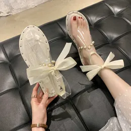 Sandals 2022 Women Summer Fashion Pearl Bow Tie Clip Toe Beach Sandals All-Match Transparent Jelly Roman Shoes Zapatos Para Mujer AA230509