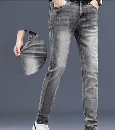 2023 modevarumärke jeans män broderi höst och vinter ny grå elastisk smal passar små fot långa byxor