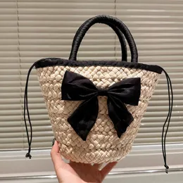 Fashionable Bowknot Bucket Beach Bag Women Hollow Out Crochet Totes Handmade Straw Woven Vegetable Basket Summer Vacation Bag with Drawstring Small Bag