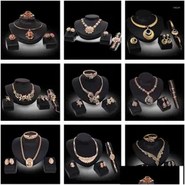 Серьговые ожерелье набор женских ювелирных изделий Европа и Америка продают шпильку с четырьмя частями капля подвесной кулон.