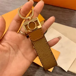 Dropship clássico amarelo marrom de couro pu PU Key Chain Accessories Fashion Keychains Fivele para homens Mulheres com varejo 253N
