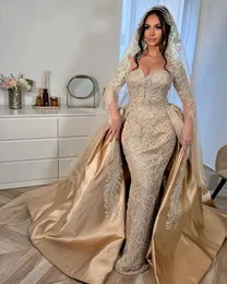 Lyxiga arabiska Dubai -champagne bröllopsklänningar för kvinna löstagbart tåg långa ärmar spets applikation sjöjungfru brudklänningar