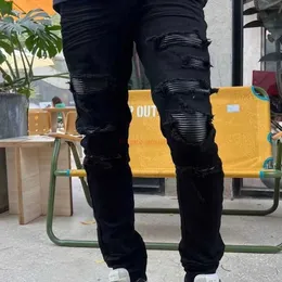 Tasarımcı Giyim Amires kot kot pantolon 2023 Yeni Amies High Street Moda Modaya Modeli Kot pantolon Kırık Delikler Pilize Yamalar Panel Deri Siyah Uzun Pantolon Dist