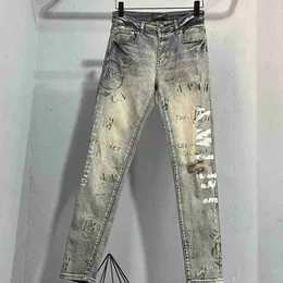 Designer Clothing Amires Jeans Denim Pants 2869 New Amies Fashion Brand Graffiti Letter Printing Washed Old Yellow Hole Stretch Slim Denim Trousers for Men Distress