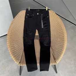 Дизайнерская одежда Amire Джинсы Джинсовые штаны Amies Джинсы Мужчина Slim Fit Real Cowhide Black Collage промыл поврежденные растягиваемые джинсовые штаны MX1 High Street.