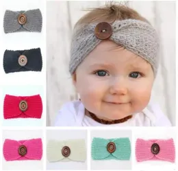 Nieuwe babymeisjes Fashion Wool Haakhoofdband Gebreide Haarband met knopdecor Winter Pasgeboren baby Warmer Headwrap22555309