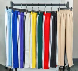 Designer calças de calmas de palmas soltas esportes de calça longa com zíper de calça de jogger calças de jogador casual listras laterais laterais esportes Sport6378607