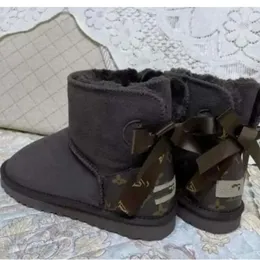 Bottes de neige en cuir véritable 2023 pour femme, avec nœud, douce et confortable, en fourrure de mouton, garde au chaud