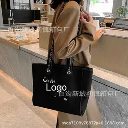 Bolsa de designer 2024 novo lançamento cedo xiaoxiang corrente crossbody versátil commuter lazer tote lona um ombro portátil feminino