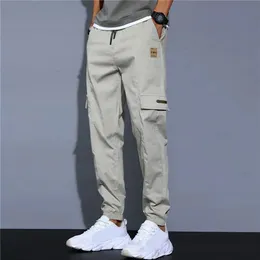 Herren Hosen Männer Seitentaschen Cargo Harem Bänder Schwarz Hip Hop Casual Männlich Jogger Hosen Mode Streetwear 231204