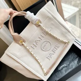 2024 Designer Bag Luxury New Women Classic Canvas Tote Bag Famous French Brand Fashion Pearl Letter Shopping Bag Big Capacity Högkvalitativ kedja axelväska 30x32