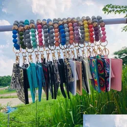 Keychains Lanyards PU 가죽 팔찌 지갑 지갑 키 체인 파티 호의 선호 TASSELS 뱅글 키 링 홀더 카드 가방 SILE BEADED WRISTLET KEYC DHDKJ