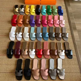 Kvinnors designer tofflor glider sandaler Kvinnor skor klassiska lambskin platt klack sommar lat mode flip flops läder sexiga sandaler strand klassiska platt sandaler