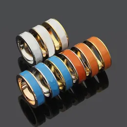 Högkvalitativ älskare Kvinnor Designer Ring White Orange Blue Dripping Oil Gold Plated Luxurious Letter Titanium Steel Aclank Rings197m