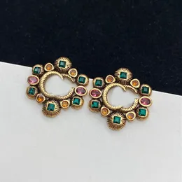 Brincos de garanhão jóias luxo letra g moda gemas coloridas clássico graça tom de ouro brinco para mulheres homens casamento pary presente d21090286y