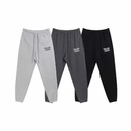 Men's pants autumn and winter new casual fleece sweatpants letter printed warm sports pants men and women the same fashion casual