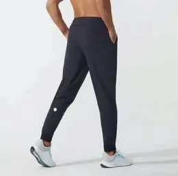 Yoga Pants Ll Men's Gogger Long Pants Sport Yoga الزي السريع الجاف الجاف جيوب الجراثيم الجبهة السراويل السراويل رجال لياقة الخصر المرنة غير الرسمية 2024