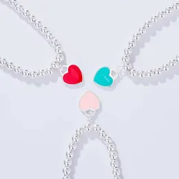 2024 Designer T -Familie High Edition V Gold CNC gedrucktem Emaille Pfirsich Herz Halskette Blau rosa Doppelform -Anhänger Armband Weibchen
