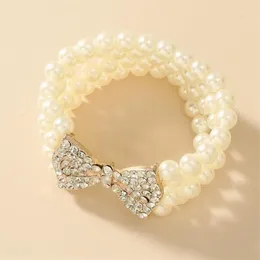 Pulsera de perlas de imitación multicapa de Nueva Barroca, pulseras con dijes de diamantes de imitación y lazo dorado de Metal para mujer, accesorios de joyería para fiesta 1263c