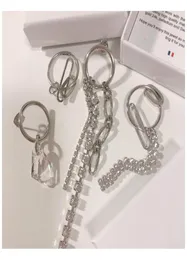 Justine Clenquet Asymetryczne metalowe łańcuch kryształowe kolczyki moda