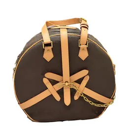 Crossbody väska nischdesign kvinnors väska med retro en-axel bärbar liten rund väska
