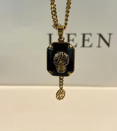 AM nuova collana in oro antico con quadrante in ottone e cristallo nero con teschio impreziosito da un elegante stile punk5609480