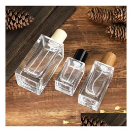 Perfume Bottles Wholesale Square Shaped Glass Spray Per Bottles 30Ml 50Ml 100Ml Empty Refillable Bottle Drop Delivery Office Dhgarden Dh5Ay