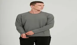 Men039s الأكمام الطويلة تتصدر رياضات اليوغا الأساسية Tshirt عالية السرعة مرنة الجافة جافة ردي