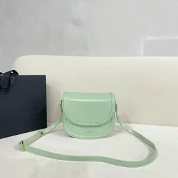 The new candy color saddle bag can be crossbody/shoulder back three layers of inner compartment inner zipper pocket hardware bright face vintage buckle women's bag