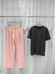 Kvinnors tvådelade byxor Designer 2023 Spring/Summer New Color Block Letter Simple Round Neck Kort ärm T-shirt Elastisk midjehemssladd tryckt bred benbyxa set c4dt