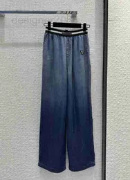 Kadınlar kot tasarımcısı şık, yakışıklı, kişiselleştirilmiş, elastik bel, açık ve ince ipek kot geniş bacak pantolon, gündelik yüksek ince gradyan mavi pantolon uizb