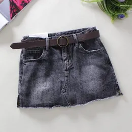 Gonne 2023 Primavera Estate Stile Tinta unita Gonna di jeans Donna Vita alta Tasche elastiche sottili Bottone Jeans abbinati Mini