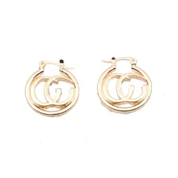 A single female exclusive earring accessory made of golden stainless steel material with a large hanging ring