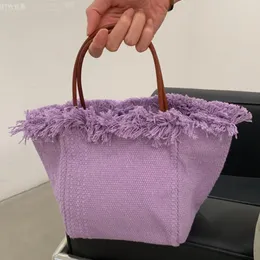Bolsos de noche cubo de moda para mujer bolsos y monederos de diseñador de lujo 2023 en algodón remache borla decoración pequeña bolsa de mensajero