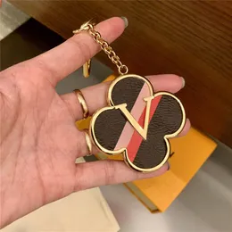 سلسلة مفاتيح Clover Lucky Clover Carn Rings ذات أربع أوراق PU PU LEATHERCHAIN ​​مفاتيح مفاتيح مشبك للرجال للنساء معلقة الديكور مع RETA299E