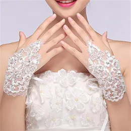 Nuovo arrivo a buon mercato Disponibile in pizzo Appliques Perline Lunghezza polso senza dita con nastro Guanti da sposa Accessori da sposa2829