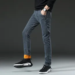 Jeans masculino Calças quentes de inverno com forro de lã elástico grosso veludo plus size 38 negócios casual masculino 230720