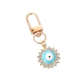 Creative Diamond Set Dripping Oil Blue Eyes Love Keychain Alloy Sun-Shaped Car Bag Keychains Pendant Presenttillbehör i bulk