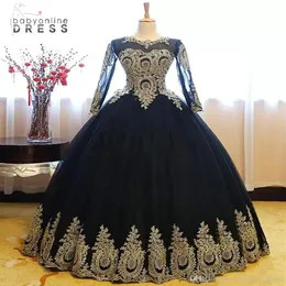 Elegantes schwarzes Gold-Spitze-Ballkleid-Quinceanera-Kleid, transparente lange Ärmel, Applikationen, Perlen, süßes 16-jähriges bodenlanges Abschlussball-Party-Eve217F