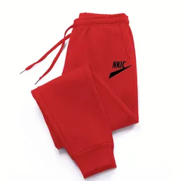 Логотип модного бренда Мужчины Женские спортивные брюки. Брюки тренируются, пробегая красные длинные брюки, спортивные беговые беговые для мужчин.