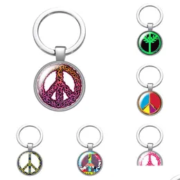 Nyckelringar lanyards fredstecken symbol glas cabochon nyckelchain väska bil nyckel kedja ringhållare charms sier färg män kvinnor gåvor släpp de dhuhk