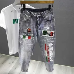 Pantaloni neri Jeans strappati con ricamo grigio nero Personalità maschile Spruzzi di colore Spruzzi di vernice Versione coreana retrò Mostra piedi elastici sottili lunghi 5AMI