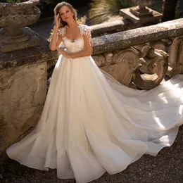 Squisite applicazioni di abiti da sposa con perline Una linea Sheer Neck Paillettes Abito da sposa Manica trasparente Castiglia Sposa Robe De Mariee