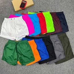 Дизайнеры мужские шорты 13 цветов короткие мужчины и женщины летние быстросохнущие водонепроницаемые пятибалльные штаны Случайные шорты плавающие шорты пляж