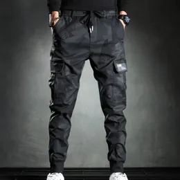 Spodnie outdoorowe Męskie spodnie Męskie spodnie noszenie bluzy Wojskowy Multi Pocket Las Camo Las na zewnątrz Elastyczne szczupłe klatki piersiowe 231103
