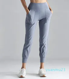 Abiti da yoga Pantaloni sportivi da allenamento a vita alta Pantaloni da donna Pantaloni sportivi fitness in tessuto Nakedfeel con due tasche laterali per